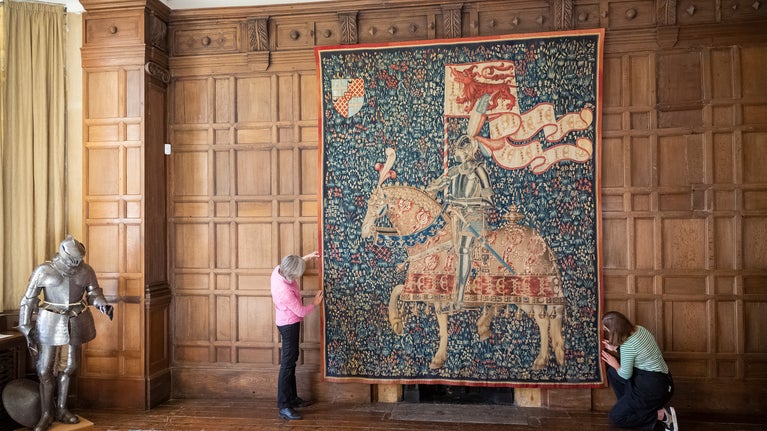 Conservators rehanging Knight with the Arms of Jean de Daillon by Guillaume Desremaulx (fl. 1468-d. 1483) at Montacute, Somerset, after conservation and cleaning.